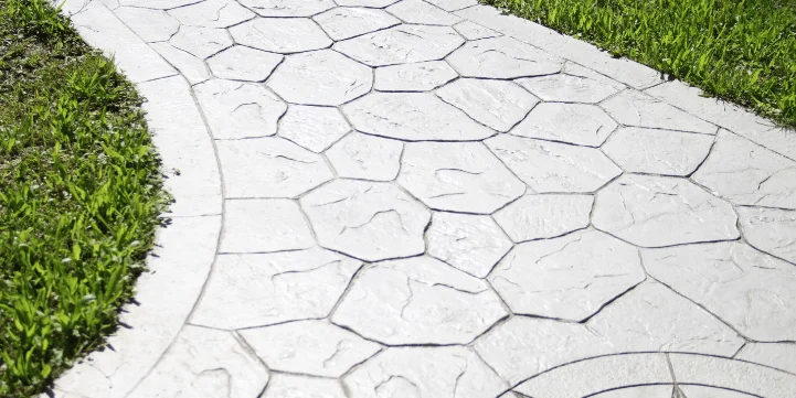 stamped concrete vs pavers carmel in